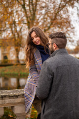 Fototapeta premium Happy young european married couple outside in fall