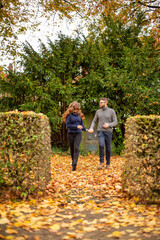 Young european married couple in park in autumn