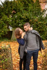 Tender young european married couple in park in autumn