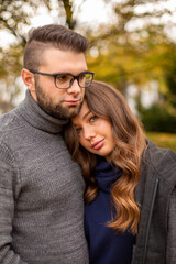 Serious young european married couple portrait in fall