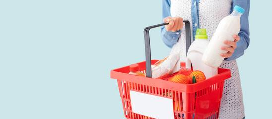 Woman doing grocery shopping and buying fresh food