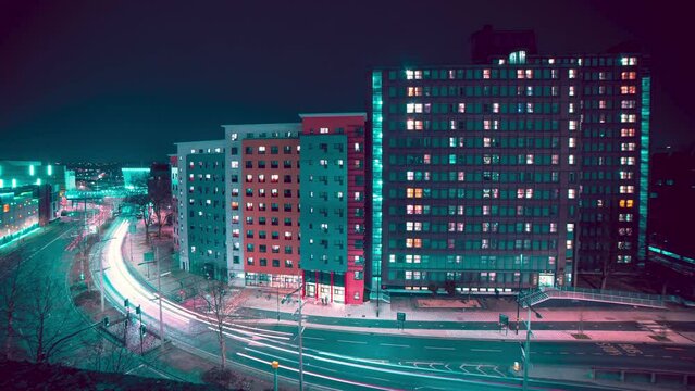Time Lapse Of Cars Light Trails On City Highway At Night, Passing Apartment Buildings