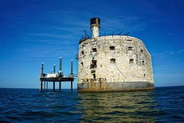 Fort boyard seen from the sea in front of a perfectly blue sky. Famous monument of Charente-Maritime in France.