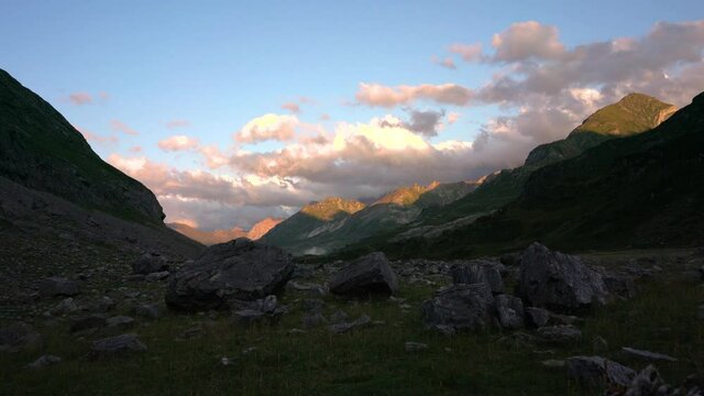 Timelapse of the Pyrenees mountains at sunset. Magnificent orange color and moving clouds.