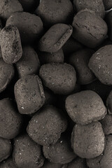 Black oak coal isolated on white background.