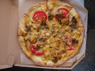 Seafood pizza as a background. Junk food.
