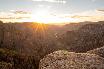 Obraz premium Warm Orange Light At Sunset Over Black Canyon