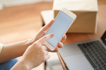 Asian woman order goods, shopping online, delivery and make payment banking by smartphone, internet and mobile application while self quarantine at home from covid-19 new lifestyle