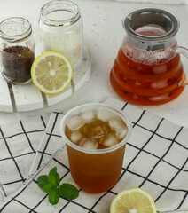 ice tea with slice of lemon in glass