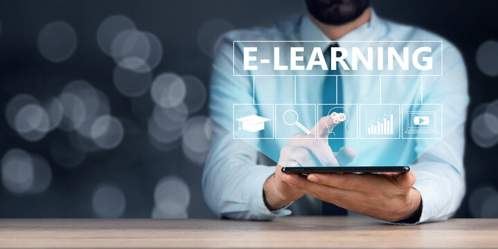 Businessman holding tablet with e-learning