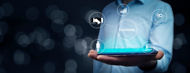 man holding tablet with training icons