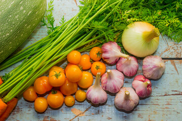 Zucchini, carrots, onions, garlic and tomatoes.