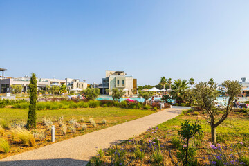 Obraz premium Beautiful exterior view of modern resort hotel on blue sky background. Greece. 