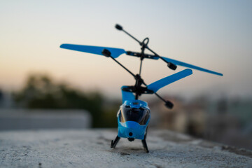 Blue coloured toy helicopter 