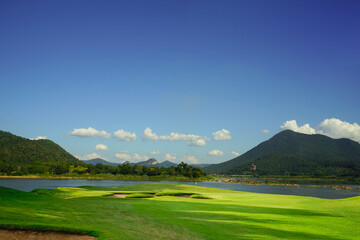 Golf course with a rich green turf beautiful scenery.