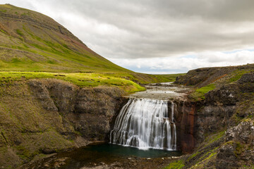 &thorn;&oacute;rufoss waterfall in Iceland during summer