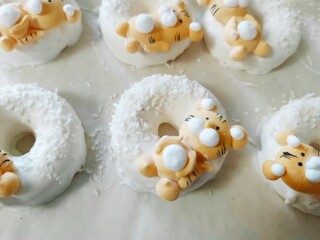 christmas donut box, donuts with icing and sprinkles	
