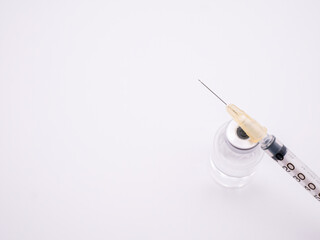 Syringe and small bottle of vaccine isolated on white background - 482217619