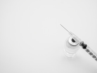 Syringe with small vaccine bottle isolated on white background - 482217654