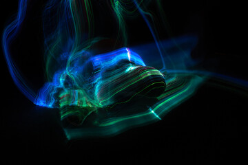 Light painting around a sea turtle with dark background.