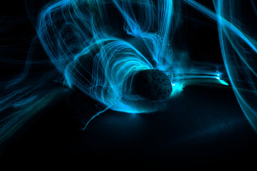 Light painting around a sea turtle with dark background.