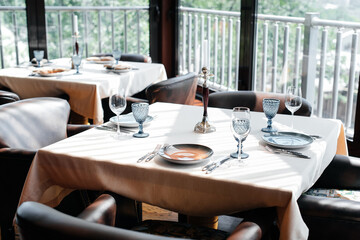 A beautifully laid table with exquisite dishes in a modern restaurant.