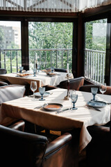 A beautifully laid table with exquisite dishes in a modern restaurant.