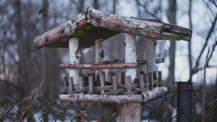 Empty Wooden Bird Feeder House on Cold Winter Day