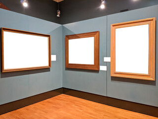 Three blank picture frames on a display wall