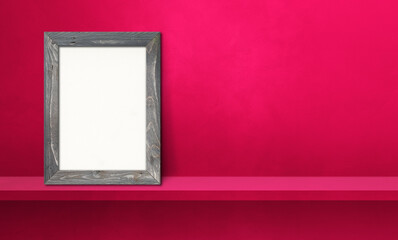 Wooden picture frame leaning on a pink shelf. 3d illustration. Horizontal banner