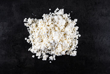 Natural background and abstraction. The texture of flour for cooking dough on a black background.
