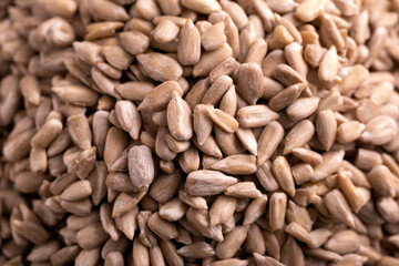 Organic peeled sunflower seeds, macro photo. Background, texture.