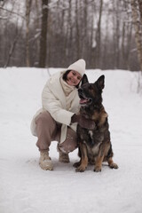 smiling girl hugs her dog