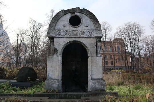 Saint Petersburg, Russia - November 2, 2021 - Vintage crypt and tombs at the Nikolskoe Cemetery in autumn. Burial place was founded in 1861, now is active and freely accessible at the present time.