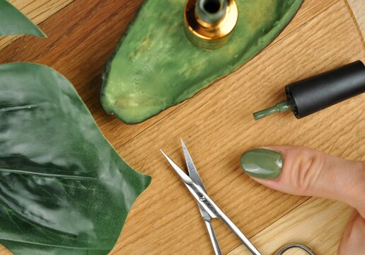 Green natural color of gel polish for manicure 