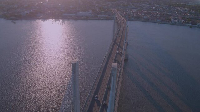 aerial view of the João Alves bridge on the Sergipe river in the city of aracaju with movement from right to left high above the bridge as cars pass on the bridge