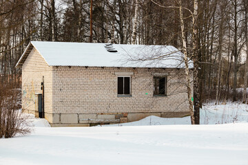 abandoned brick house in winter