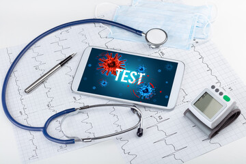 Tablet pc and doctor tools on white surface