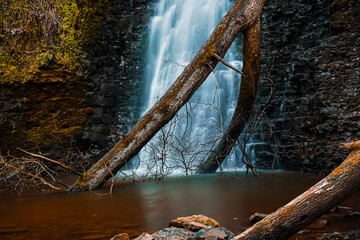 Scenic View Of Waterfall In Forest Long Exposure - In Falling Foss Forest