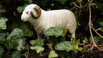 Farm animal made of plastic for kids to play. Toy ram made of plastic.