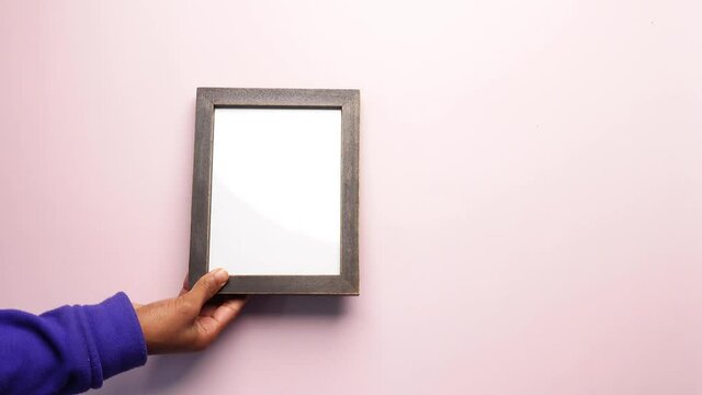 putting a photo frame on color background 