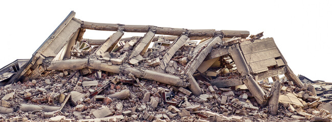 Collapsed and destroyed concrete industrial building isolated on white background. Disaster scene...