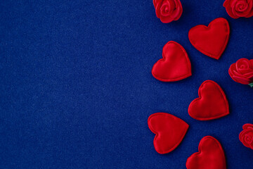 Red love heart on a blue background. Valentines day greeting card concept. Copy space.
