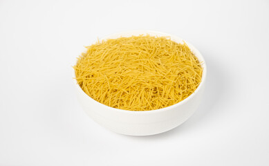 Raw Cavatappi Cellentani pasta in a plate isolated on white background top view