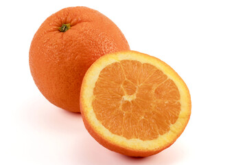 Whole and sliced oranges. Ripe oranges isolated on white background.