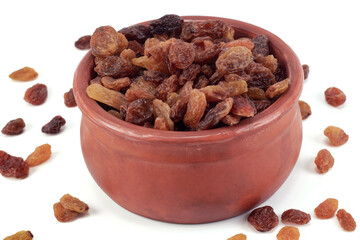 Sweet raisins or dried sweet grapes in a bowl isolated on a white background