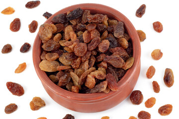 Bowl of raisins on a white background. Dried grapes.