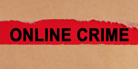 Among the torn sheets of paper on a red background, the inscription - Online Crime