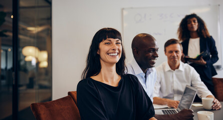 Businesswoman laughing during a meeting