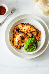 Fried Chili Spicy Egg Breakfast with Fresh Avocado on White Kitchen Background